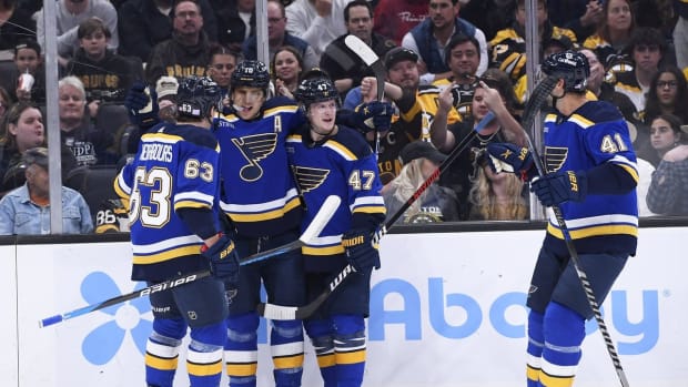 Nov 7, 2022; Boston, Massachusetts, USA; St. Louis Blues center Brayden Schenn (10) celebrates his goal with left wing Jake Neighbours (63) and defenseman Torey Krug (47) during the second period against the Boston Bruins at TD Garden. Mandatory Credit: Bob DeChiara-USA TODAY Sports